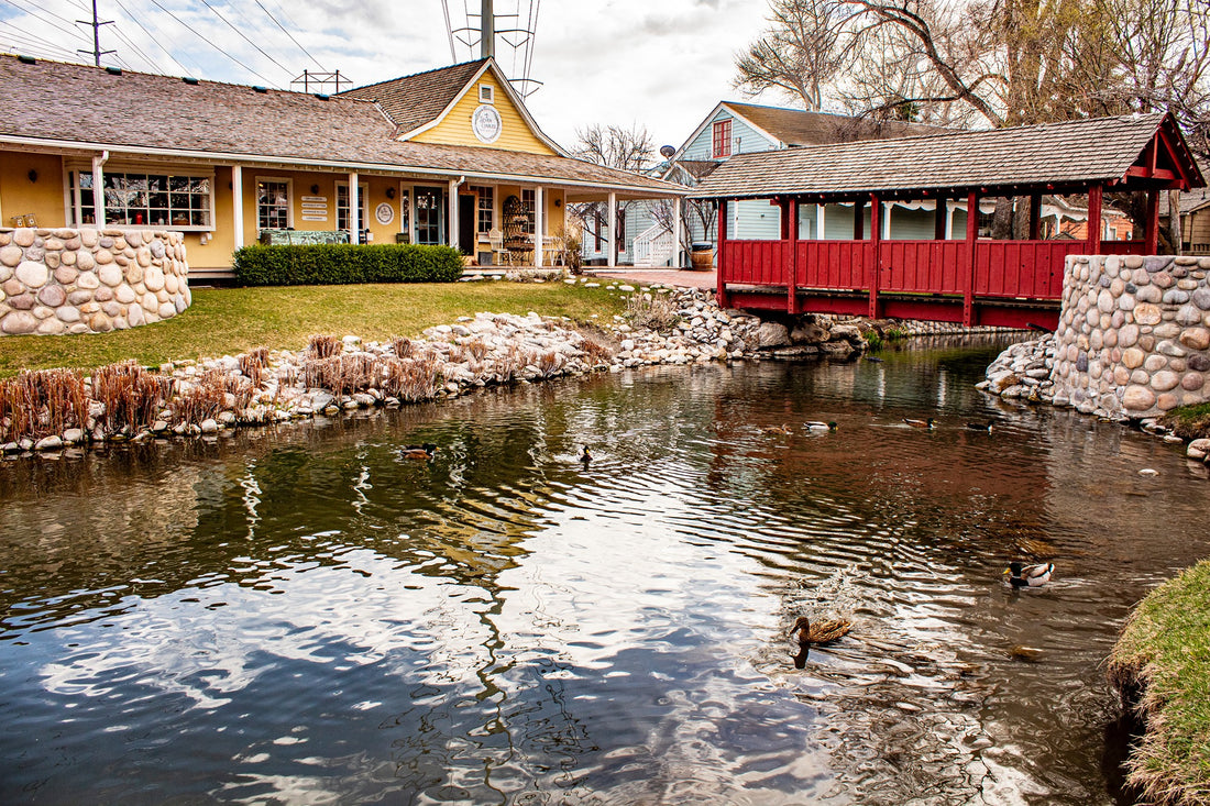 seven gables mercantile storefront with red bridge